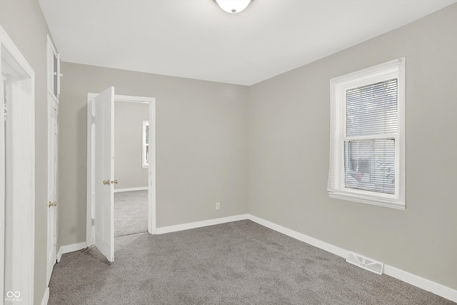 unfurnished bedroom with carpet flooring