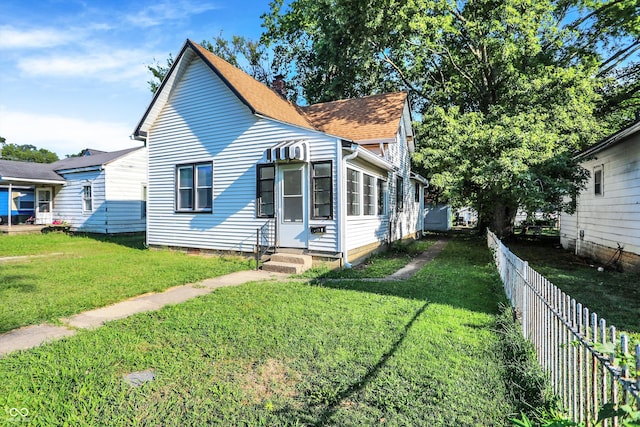 view of front of house with a front lawn