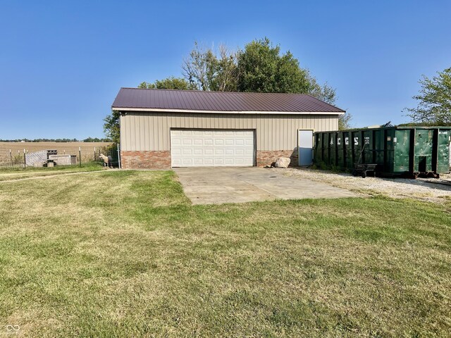 garage featuring a yard