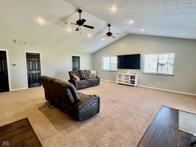 living room featuring carpet flooring, plenty of natural light, ceiling fan, and lofted ceiling