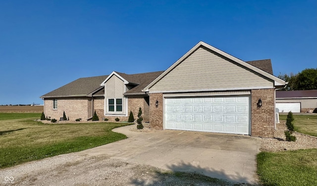 single story home with brick siding, driveway, an attached garage, and a front yard