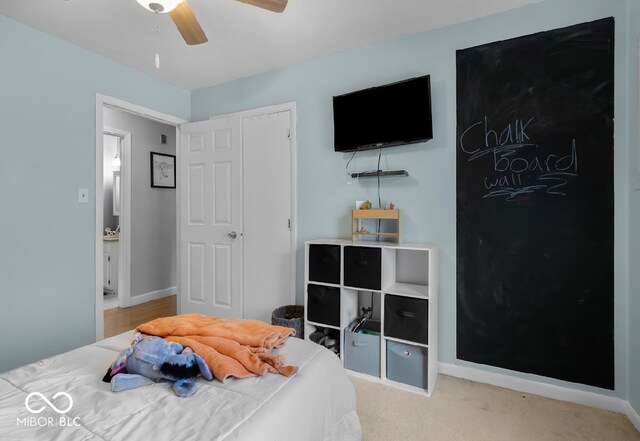 bedroom with light colored carpet and ceiling fan