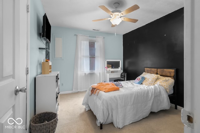 bedroom featuring light carpet and ceiling fan