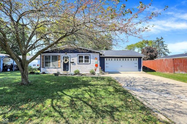 ranch-style home featuring a front yard and a garage