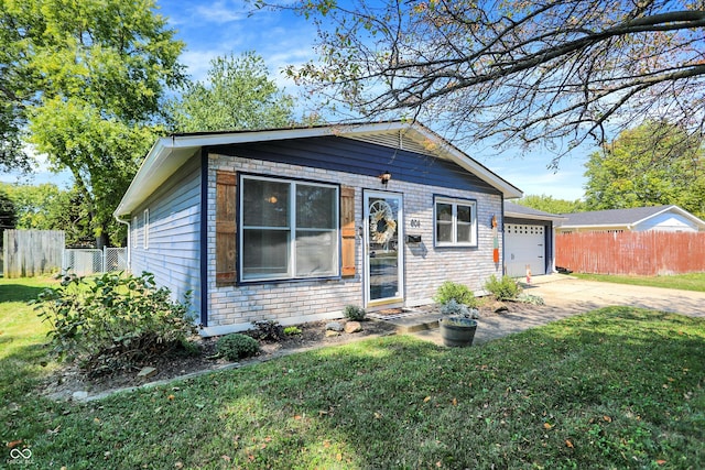 view of front facade with a front yard and a garage