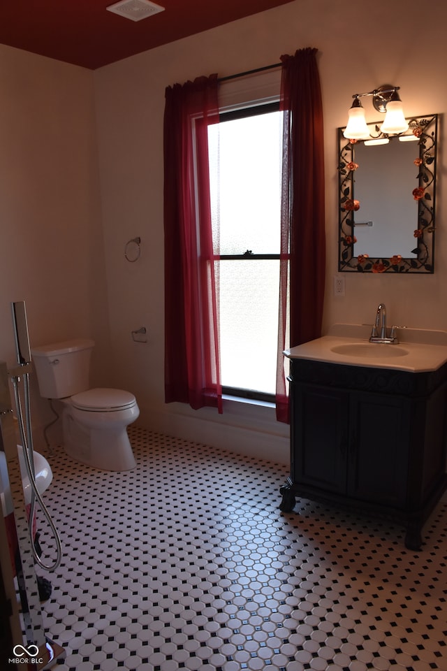 bathroom with vanity and toilet