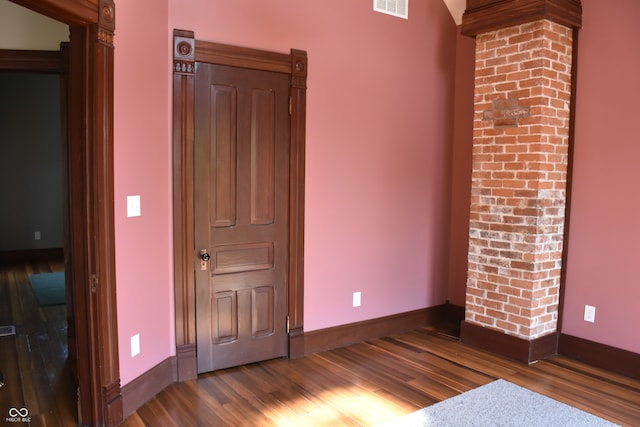 unfurnished bedroom with hardwood / wood-style flooring