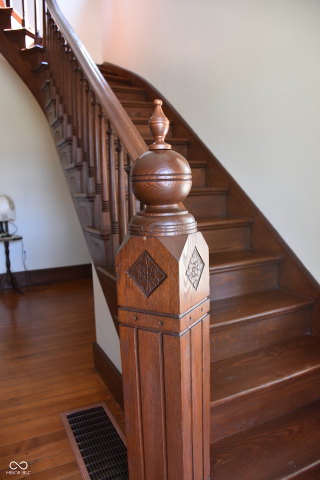 stairway featuring hardwood / wood-style flooring