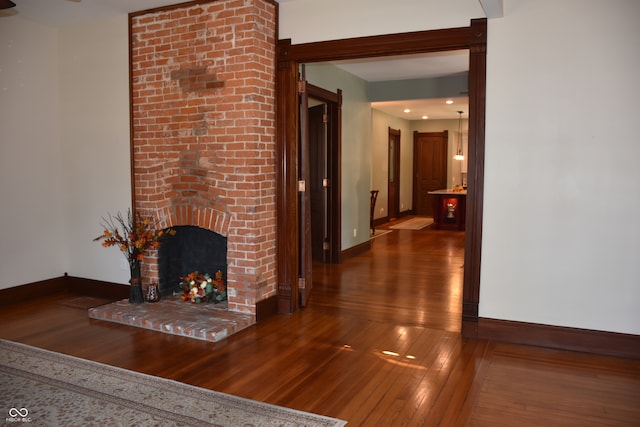 hall with dark hardwood / wood-style floors