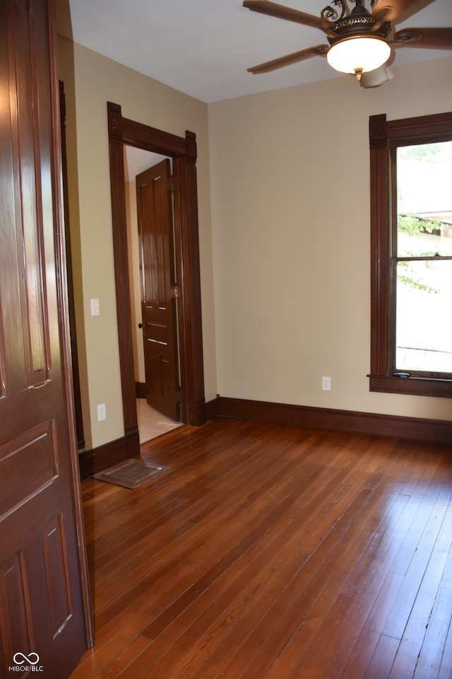 spare room featuring ceiling fan and hardwood / wood-style flooring