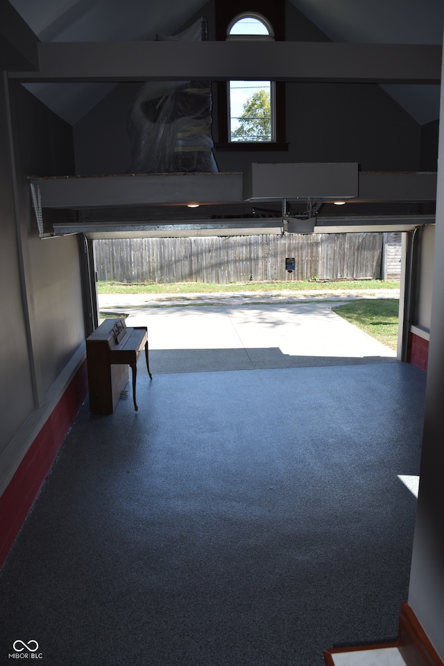 interior space with lofted ceiling and a healthy amount of sunlight