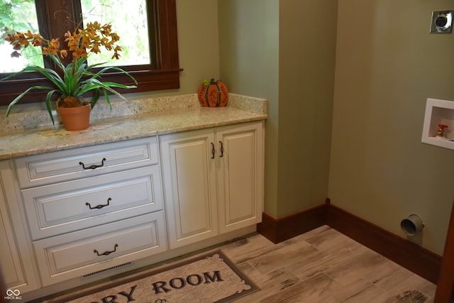 bathroom featuring vanity and hardwood / wood-style floors