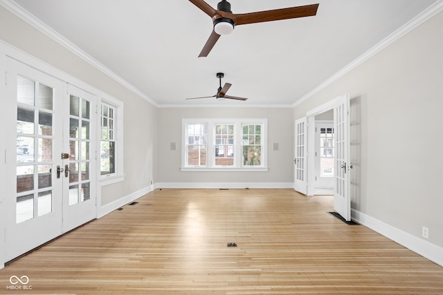 interior space with ceiling fan, baseboards, ornamental molding, light wood-style flooring, and french doors