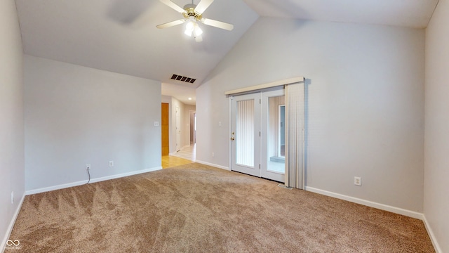 unfurnished bedroom featuring light carpet, vaulted ceiling, ceiling fan, and a closet