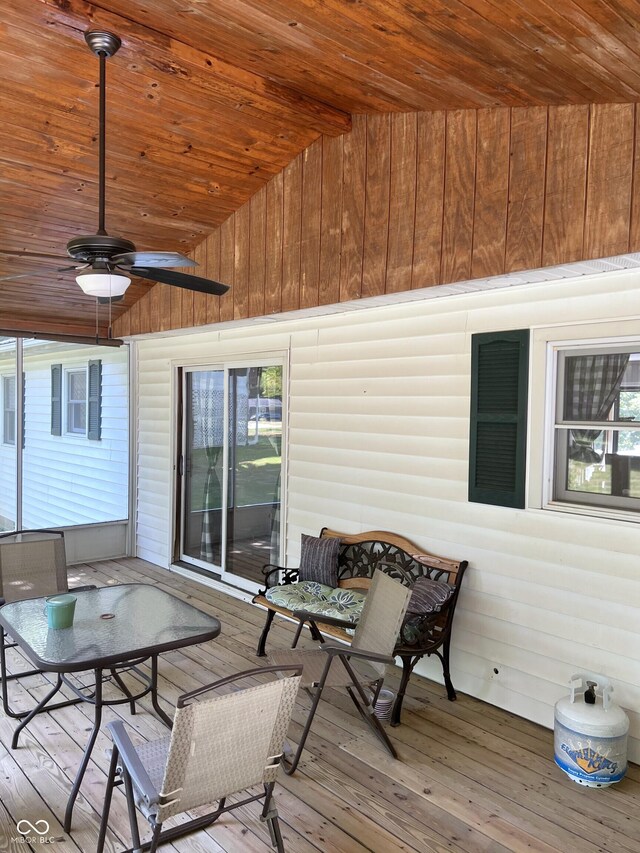 wooden terrace featuring ceiling fan