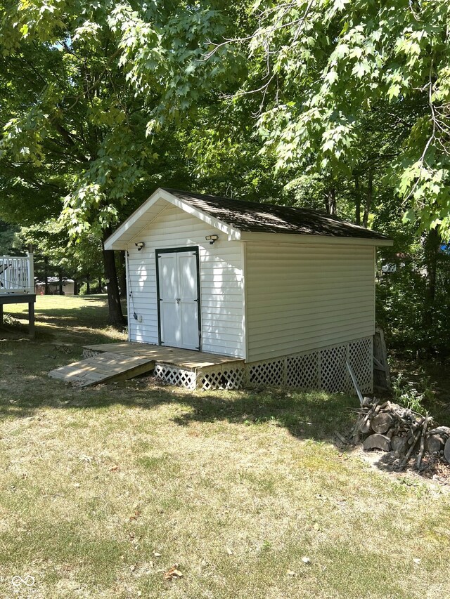 view of outdoor structure featuring a lawn