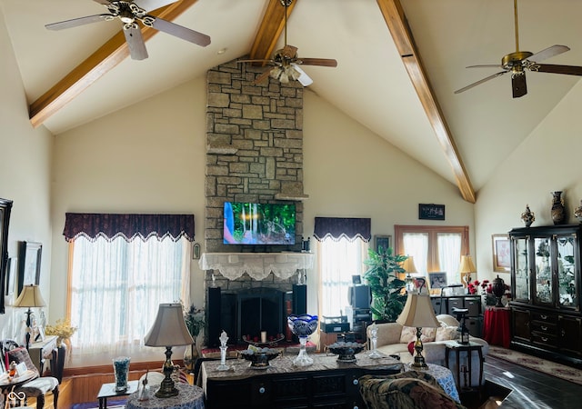 living room featuring a fireplace, high vaulted ceiling, beamed ceiling, and hardwood / wood-style flooring