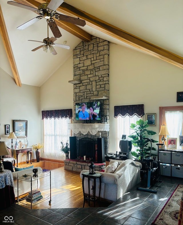 living room with beam ceiling, a fireplace, plenty of natural light, and dark wood-type flooring