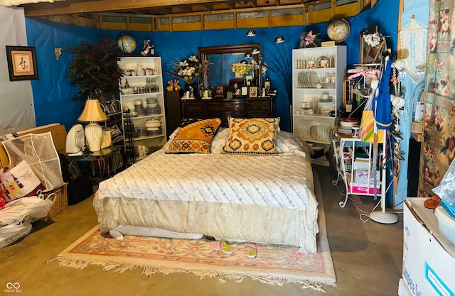 bedroom featuring concrete flooring