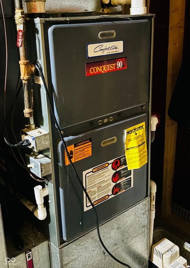 utility room featuring heating unit