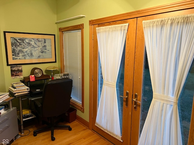 office area featuring french doors and light hardwood / wood-style floors