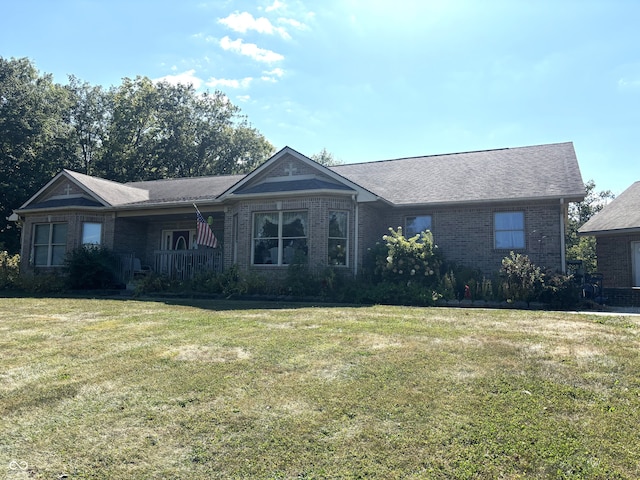 ranch-style home with a front lawn