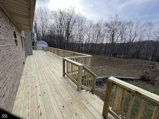 wooden deck with a garage and an outdoor structure