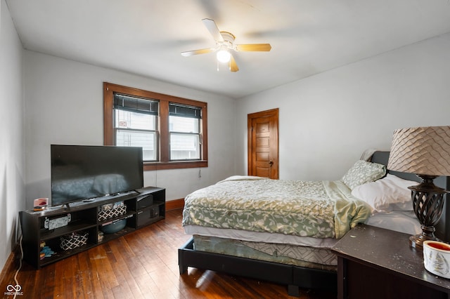 bedroom with ceiling fan and hardwood / wood-style floors