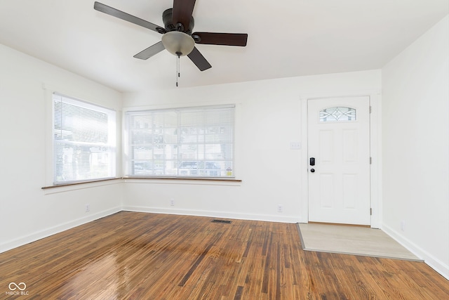 foyer entrance with wood-type flooring and ceiling fan