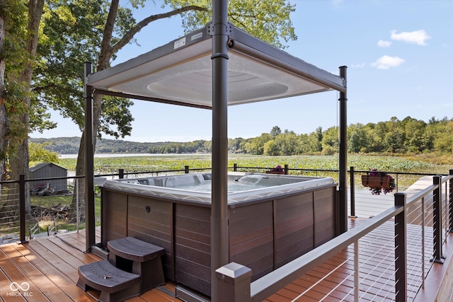 wooden deck with a hot tub