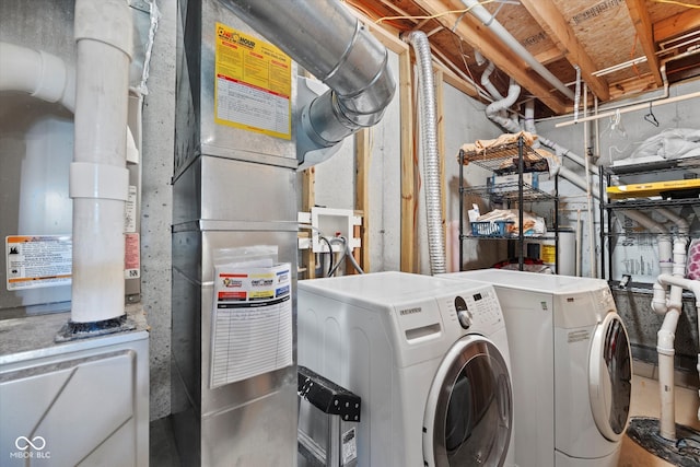 laundry room with independent washer and dryer