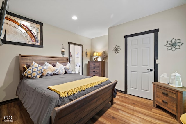 bedroom featuring light hardwood / wood-style flooring