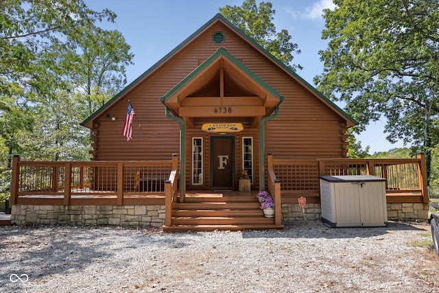 cabin with a wooden deck