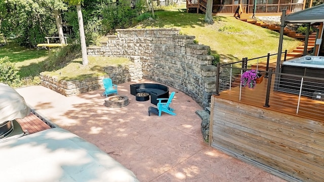 view of patio / terrace featuring an outdoor fire pit