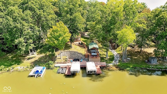 birds eye view of property with a water view