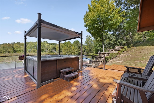 wooden deck with a hot tub