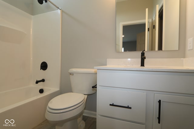 full bathroom featuring vanity, bathing tub / shower combination, and toilet