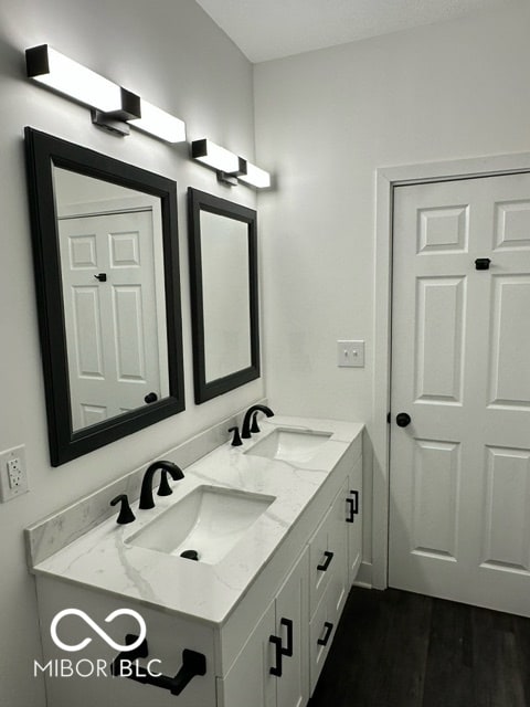 bathroom featuring hardwood / wood-style floors and vanity