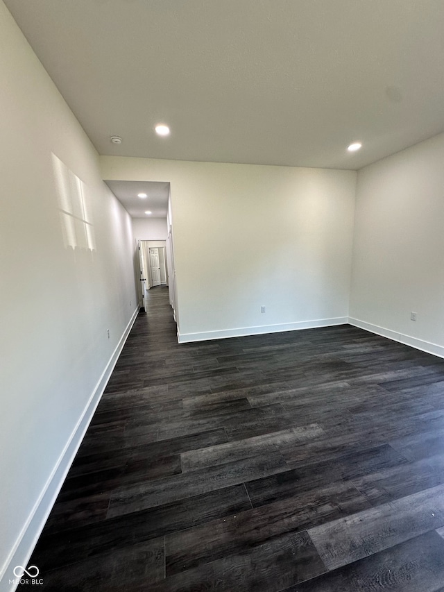 unfurnished room featuring dark hardwood / wood-style flooring