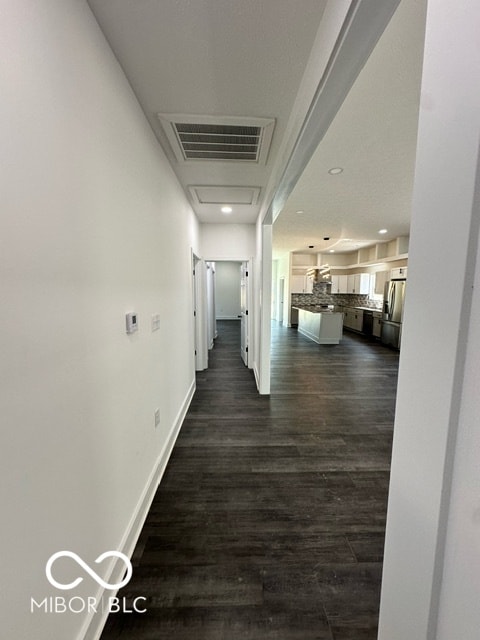 hallway featuring dark wood-type flooring