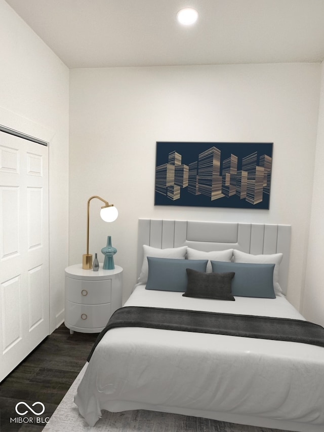 bedroom featuring dark hardwood / wood-style floors and a closet