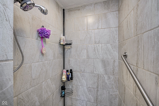 interior space featuring a tile shower