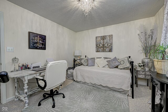 bedroom featuring a textured ceiling and an inviting chandelier