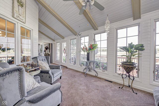 sunroom / solarium with lofted ceiling with beams and ceiling fan