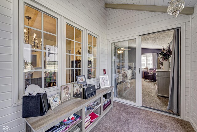 sunroom with wood ceiling and lofted ceiling with beams