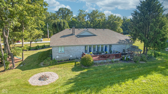 exterior space with a yard and a wooden deck