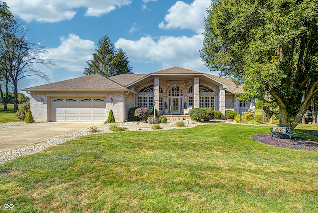 ranch-style house with a garage and a front yard