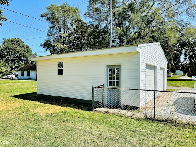 exterior space featuring a yard and a garage