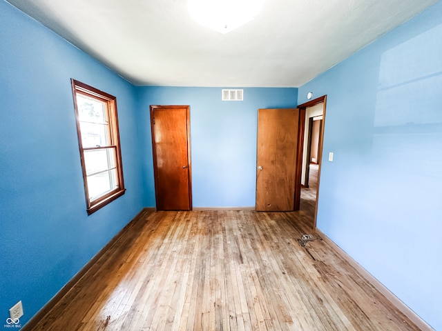 unfurnished bedroom featuring light hardwood / wood-style flooring