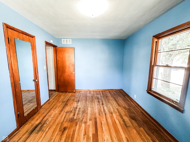 unfurnished bedroom featuring wood-type flooring